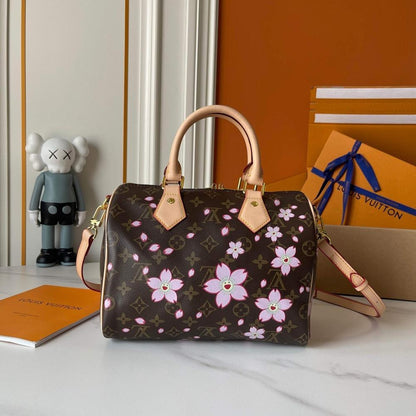 Speedy Monogram Leather Top Handle Bag