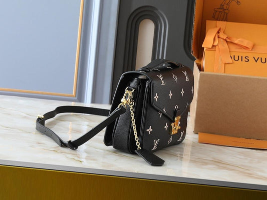 The Pouch Monogram Leather Top Handle Bag