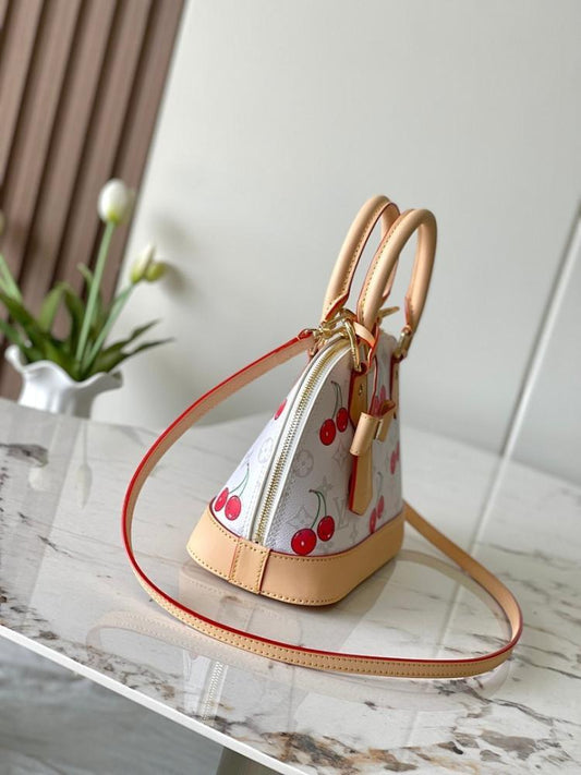 Alma Monogram Leather Top Handle Bag