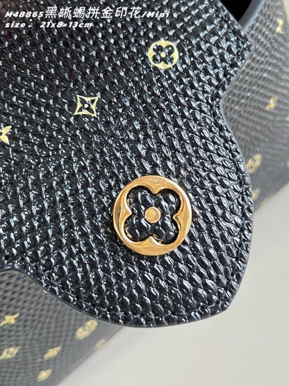 Capucines Leather Top Handle Bag