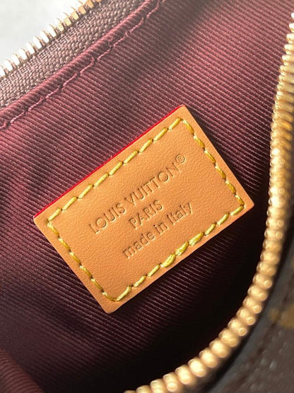 Elegant Monogram Leather Top Handle Bag – Limited Edition