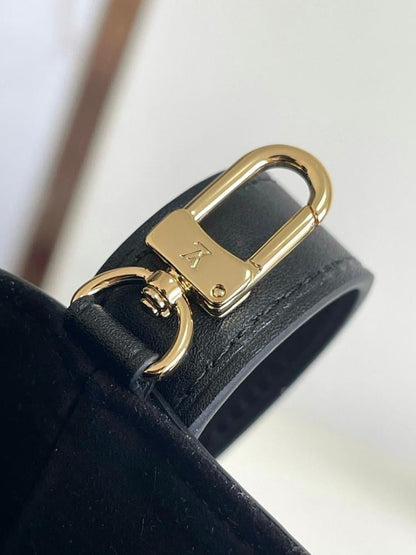 Modern Refined Monogram Leather Bucket Bag