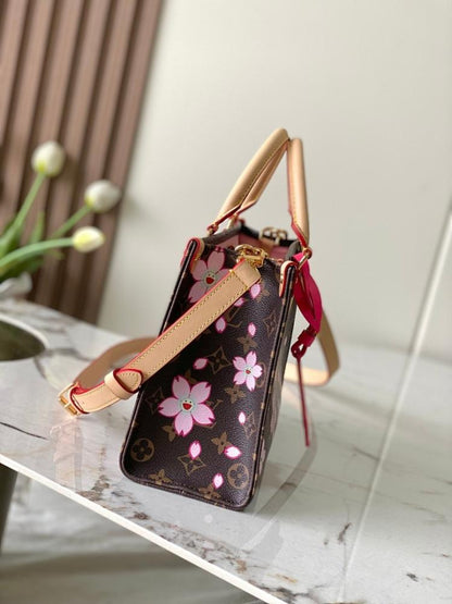 OnTheGo Monogram Leather Top Handle Bag